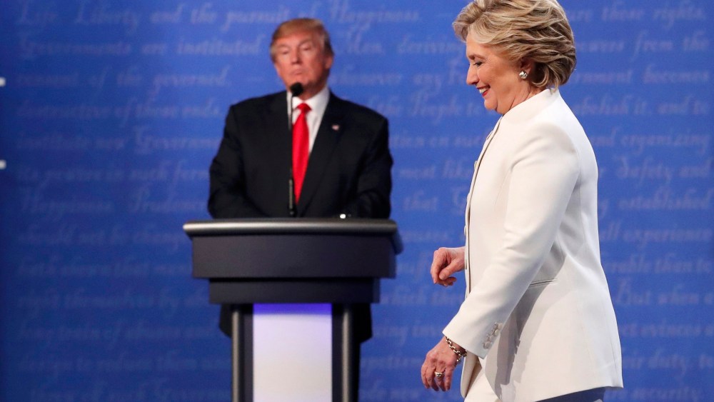Image: Democratic U.S. presidential nominee Clinton walks off the debate stage as Republican U.S. presidential nominee Trump remains at his podium after the conclusion of their third and final 2016 presidential campaign debate in Las Vegas