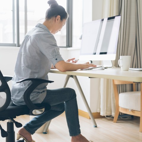 Image: A woman works from home
