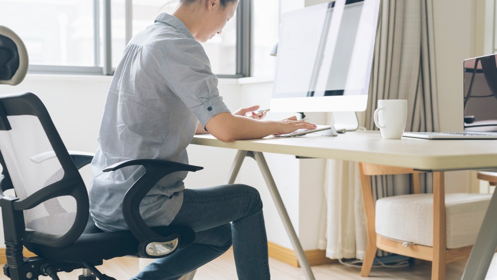 Image: A woman works from home