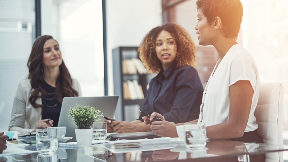 Image: A group of colleagues having a meeting in an office