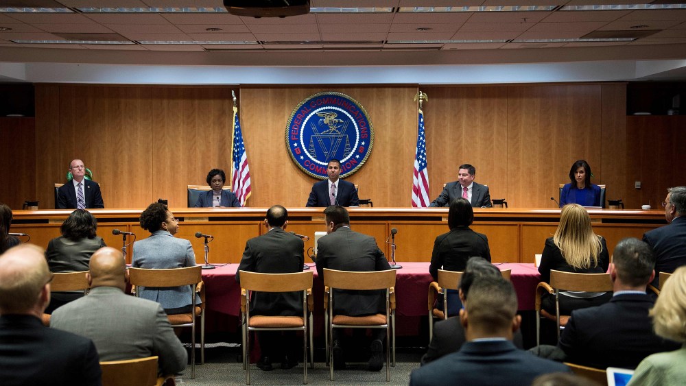 Image: FCC Chairman Ajit Pai and commission members take their seats