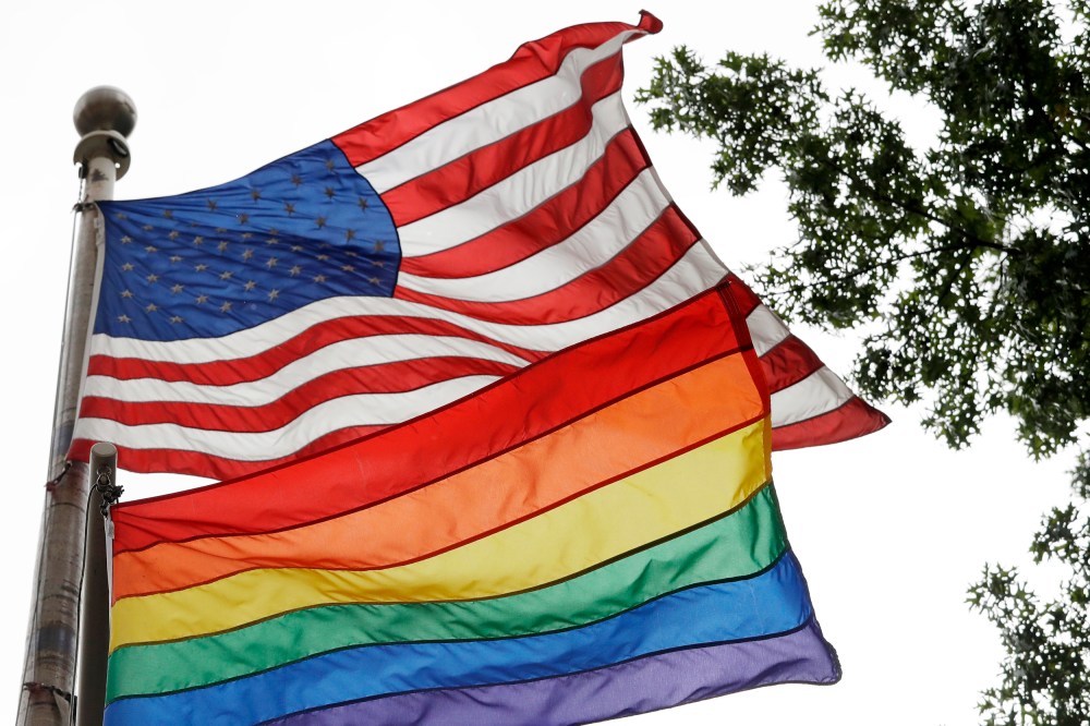 Image: The rainbow flag flies beneath the American flag