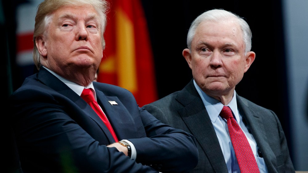 Image: President Donald Trump, left, sits with Attorney General Jeff Session