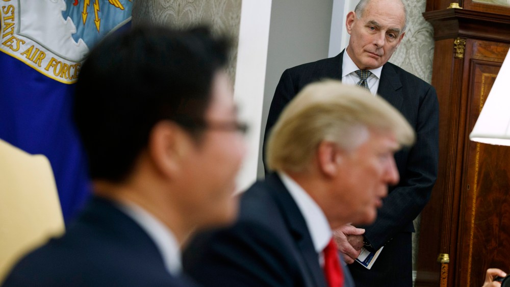 Image: White House Chief of Staff John Kelly listens during a meeting