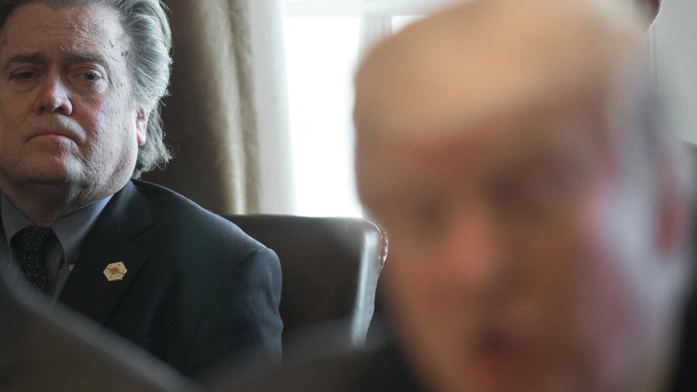 Image: Steve Bannon listens as President Donald Trump speaks to the media