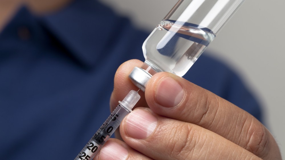Image: Preparing syringe for insulin shot
