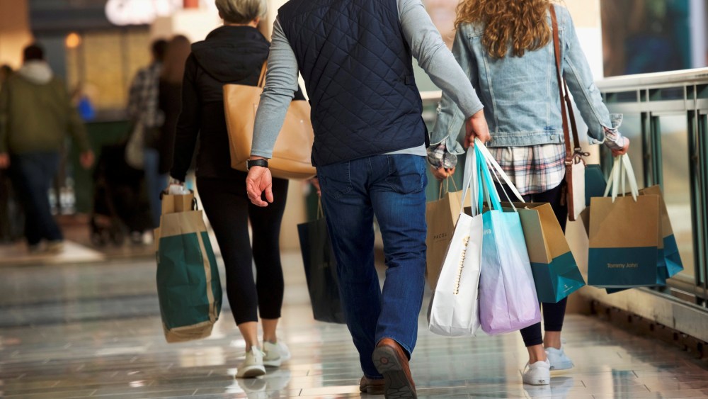 Image: FILE PHOTO: Shoppers carry bags of purchased merchandise at the King of Prussia Mall, United States' largest retail shopping space, in King of Prussia