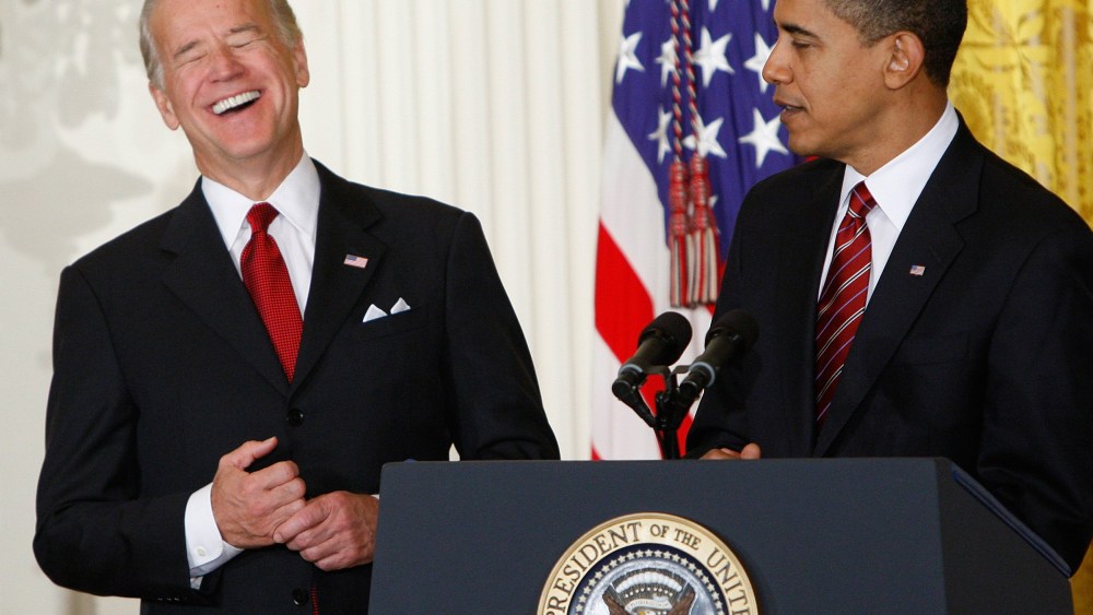 Image: Vice President Joe Biden laughs during a light moment as President Barack Obama speaks in the East Room of the White House