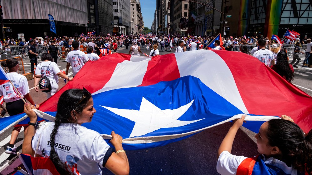 Image: People march in the Puerto Rican Day Parade on 5th Avenue in New York on June 9, 2019.