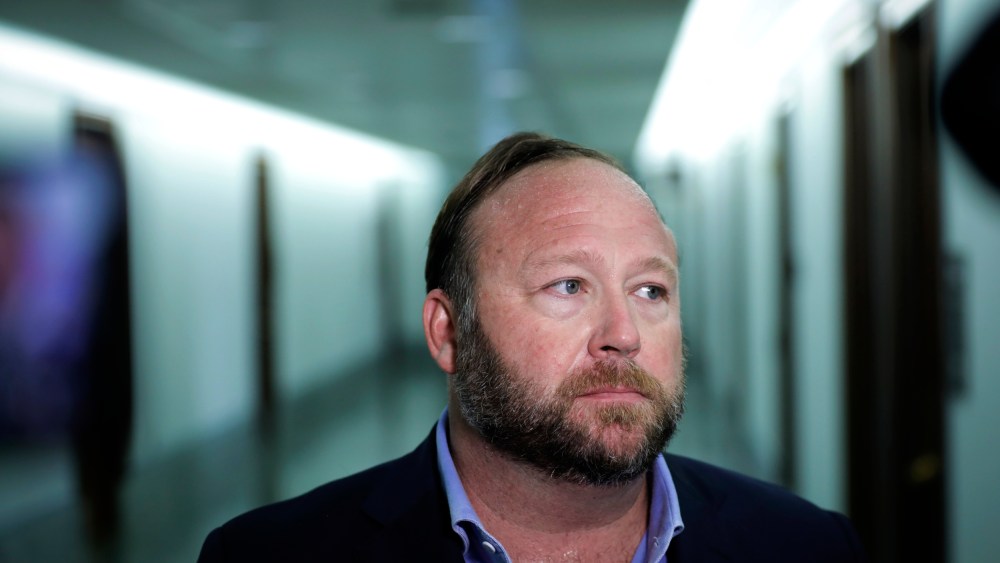 Image: Alex Jones speaks to reporters outside of a Senate Intelligence Committee hearing on Sept. 5, 2018.