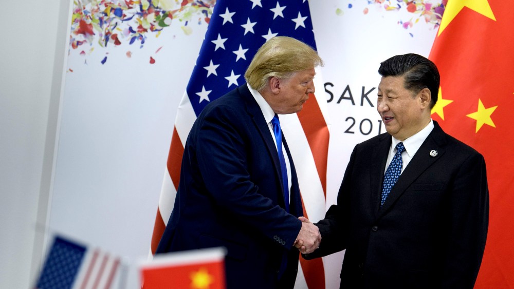 Image: President Donald Trump greets China's President Xi Jinping during the G20 Summit in Osaka on June 29, 2019.
