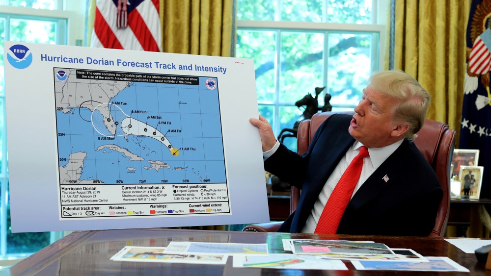 Image: UPresident Donald Trump holds an early projection map of Hurricane Dorian in the Oval Office on Sept. 4, 2019.