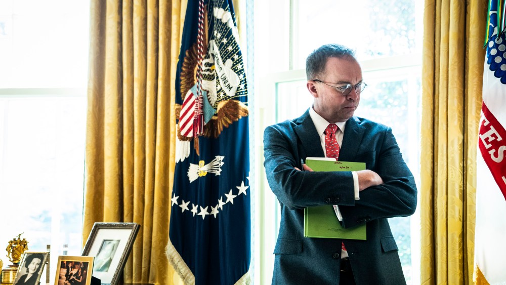 Image: Acting White House Chief of Staff Mick Mulvaney listens in the Oval Office on March 19, 2019.