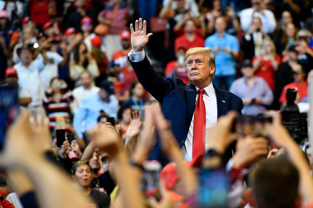 Image: President Donald Trump waves to supporters during a "Keep America Great" campaign rally in Sunrise