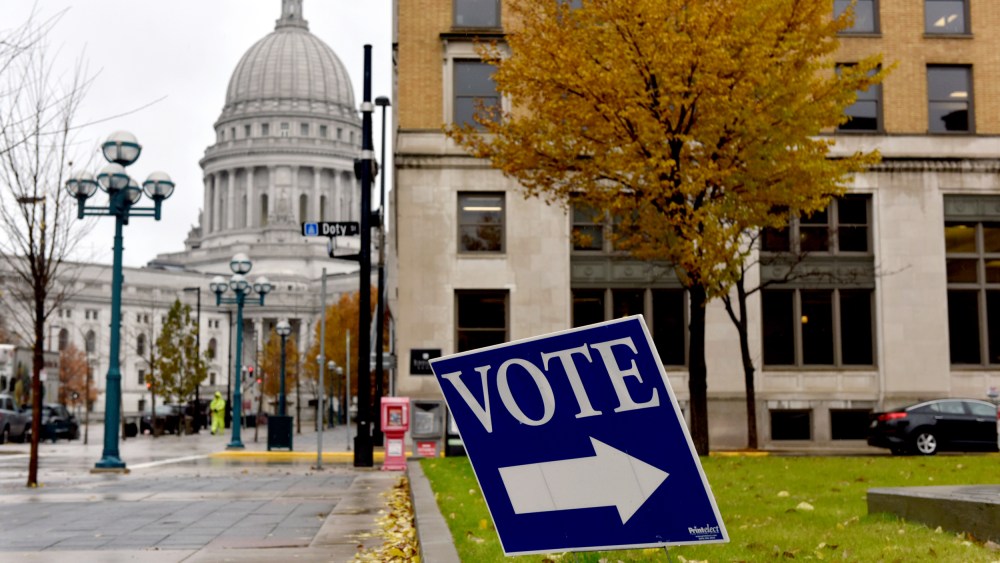 Image: A sign for a polling place near the state capitol in Madison, Wis., on Nov. 6, 2018.