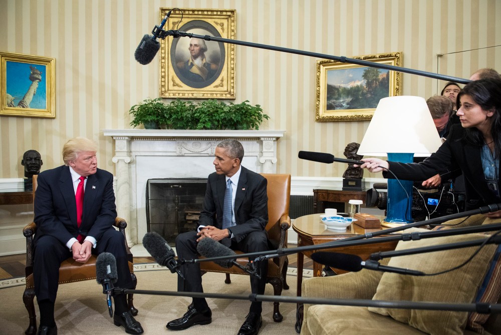 President Barack Obama talks with President-elect Donald Trump in the Oval Office