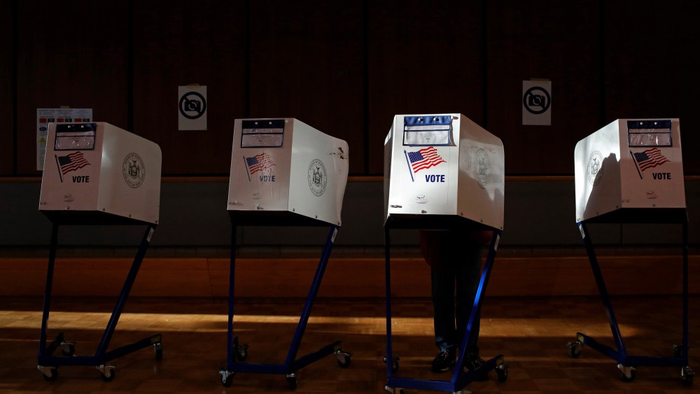 Image: A voter fills out a ballot at a Harlem community center in New York on Nov. 8, 2016.