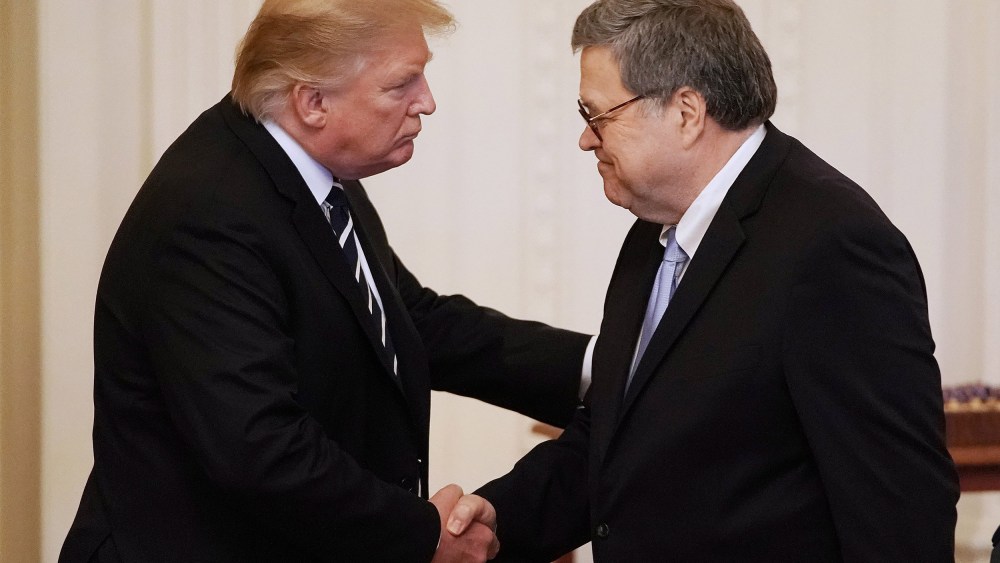 Image: President Donald Trump shakes hands with Attorney General William Barr in the East Room of the White House