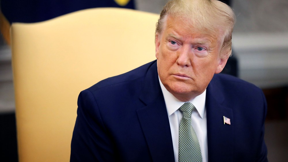 Image: President Donald Trump speaks to reporters in the Oval Office on March 12, 2020.