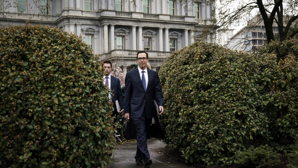 Image: Treasury Secretary Steve Mnuchin leaves a television interview outside of the White House on March 13, 2020.