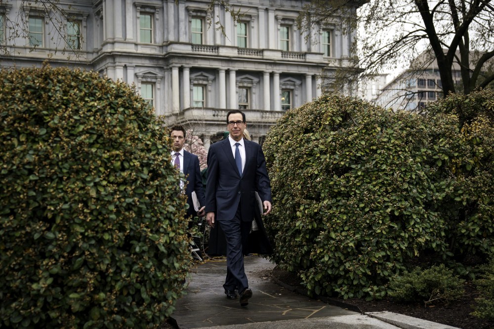 Image: Treasury Secretary Steve Mnuchin leaves a television interview outside of the White House on March 13, 2020.
