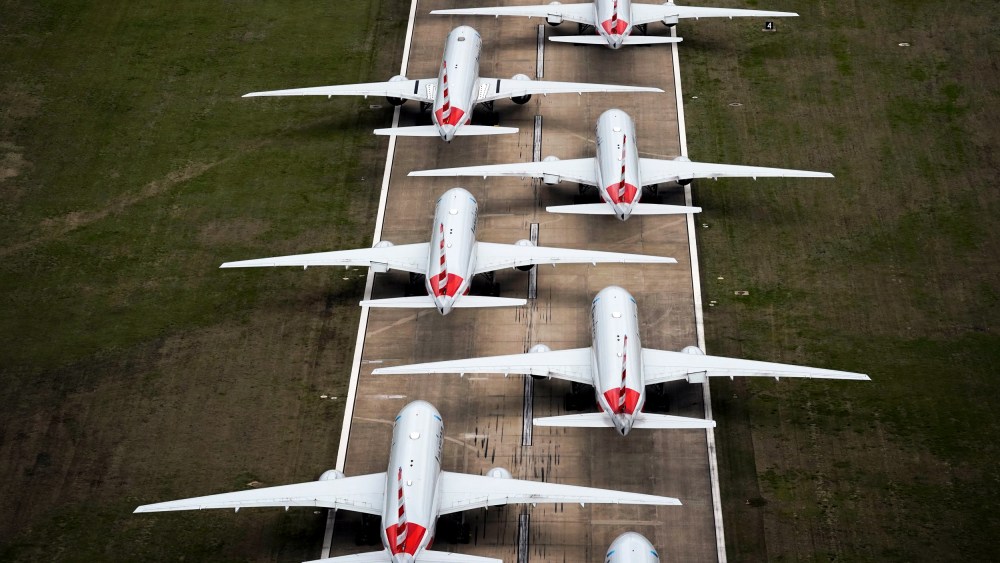 Image: American Airlines planes parked on a runway after flight reductions in response to the spread of coronavirus at Tulsa International Airport in Oklahoma on March 23, 2020.