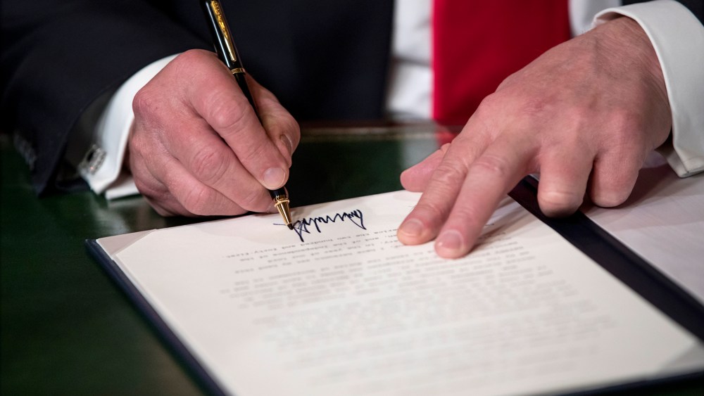 Image: President Donald Trump signs his cabinet nominations into law on Jan. 20, 2017.
