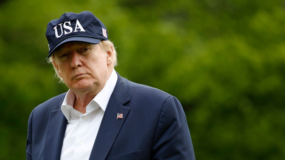 Image: President Donald Trump walks on the South Lawn of the White House after stepping off Marine One