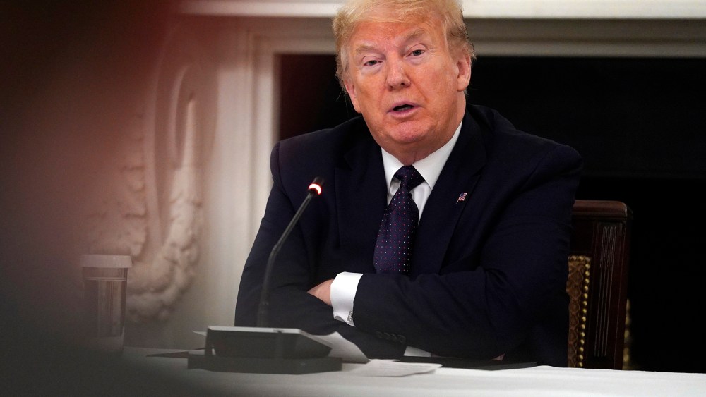 Image: President Donald Trump listens during a meeting with restaurant industry executives about the coronavirus response, in the State Dining Room of the White House