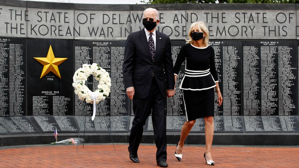 Image: Joe Biden and his wife, Jill, lay a wreath at the Veterans Memorial Park at the Delaware Memorial Bridge on May 25, 2020.