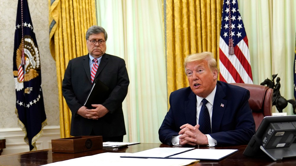 Image: President Donald Trump speaks before signing an executive order aimed at curbing protections for social media giants, in the Oval Office of the White House, Thursday, May 28, 2020, in Washington, as Attorney General William Barr listens.