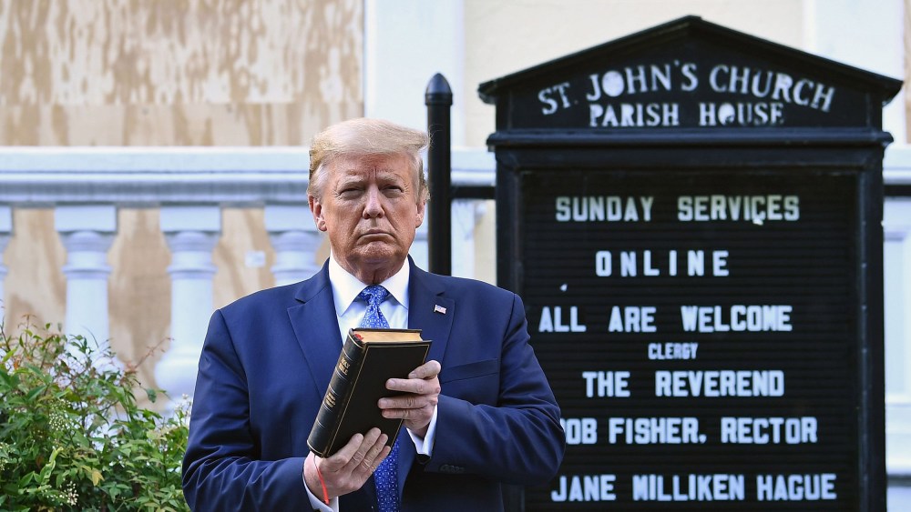 Image: President Donald Trump holds up a Bible outside of St John's Episcopal church across Lafayette Park in Washington, DC
