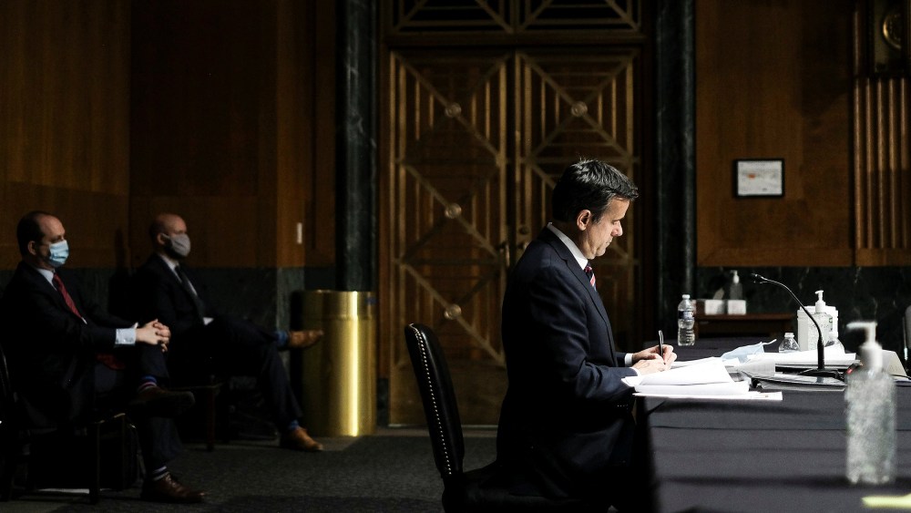 Image: U.S. Rep. John Ratcliffe finishes testifying before a Senate Intelligence Committee nomination hearing on Capitol Hill in Washington