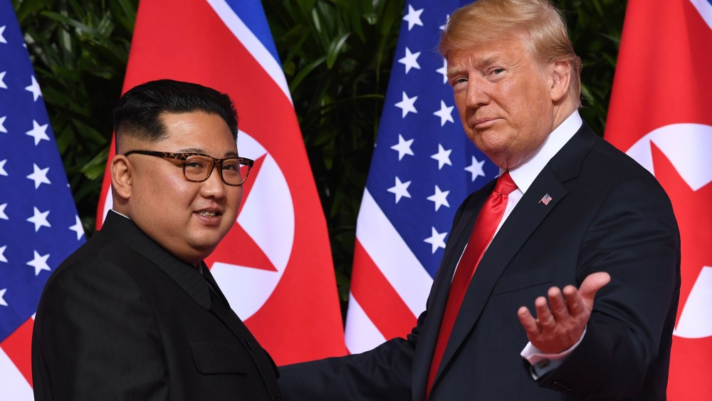 Image: President Donald Trump gestures as he meets with North Korea's leader Kim Jong Un at the start of their historic U.S.-North Korea summit at the Capella Hotel on Sentosa island in Singapore