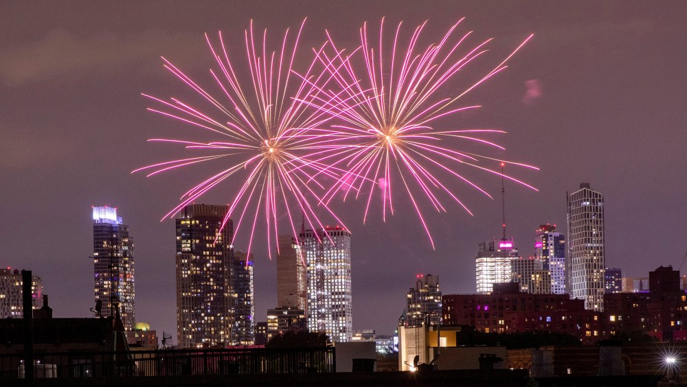 Image: Illegal fireworks illuminate the sky over the Bedford-Stuyvesant neighborhood of the Brooklyn borough of New York City, New York