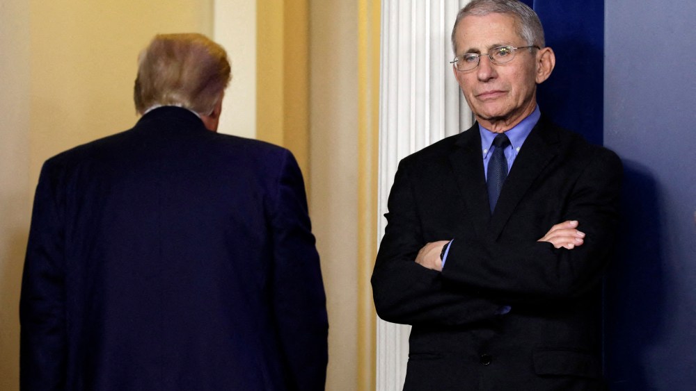Dr. Anthony Fauci reacts as U.S. President Donald Trump leaves after his press briefing on the coronavirus at the White House on March 26, 2020.