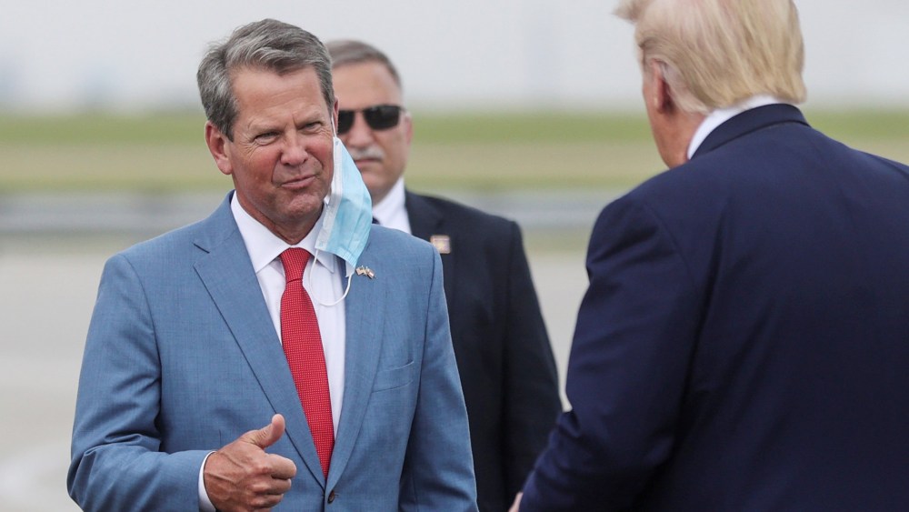 Image: Georgia Gov. Brian Kemp greets President Donald Trump in Atlanta