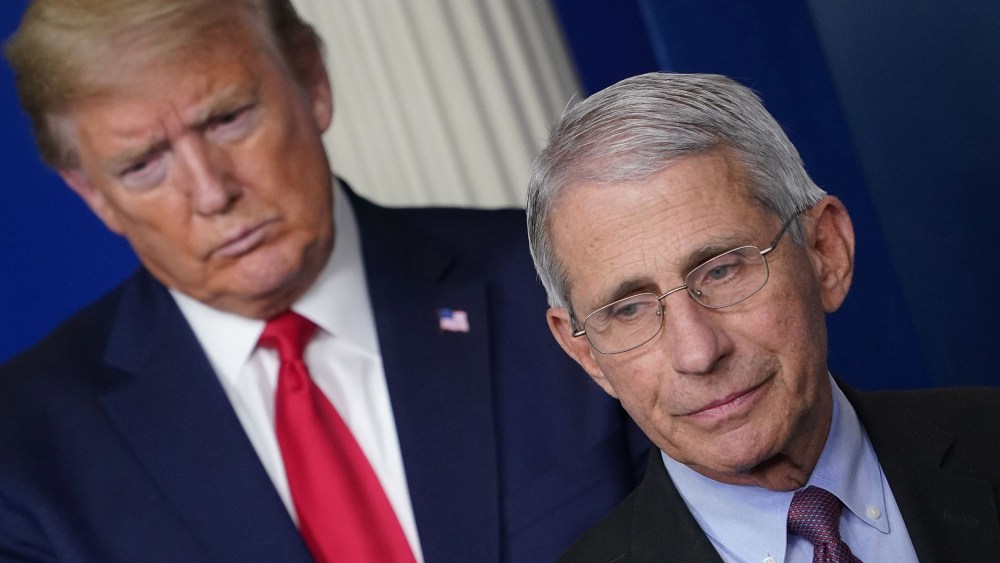 Image: Anthony Fauci, flanked by President Donald Trump, speaks during the daily briefing on the novel coronavirus at the White House