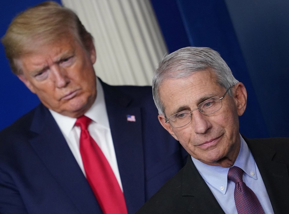 Image: Anthony Fauci, flanked by President Donald Trump, speaks during the daily briefing on the novel coronavirus at the White House