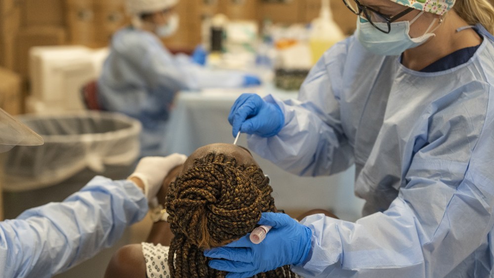 Medical workers from New York test for the coronavirus disease (COVID-19) at a temporary testing site in Houston on July 17, 2020.