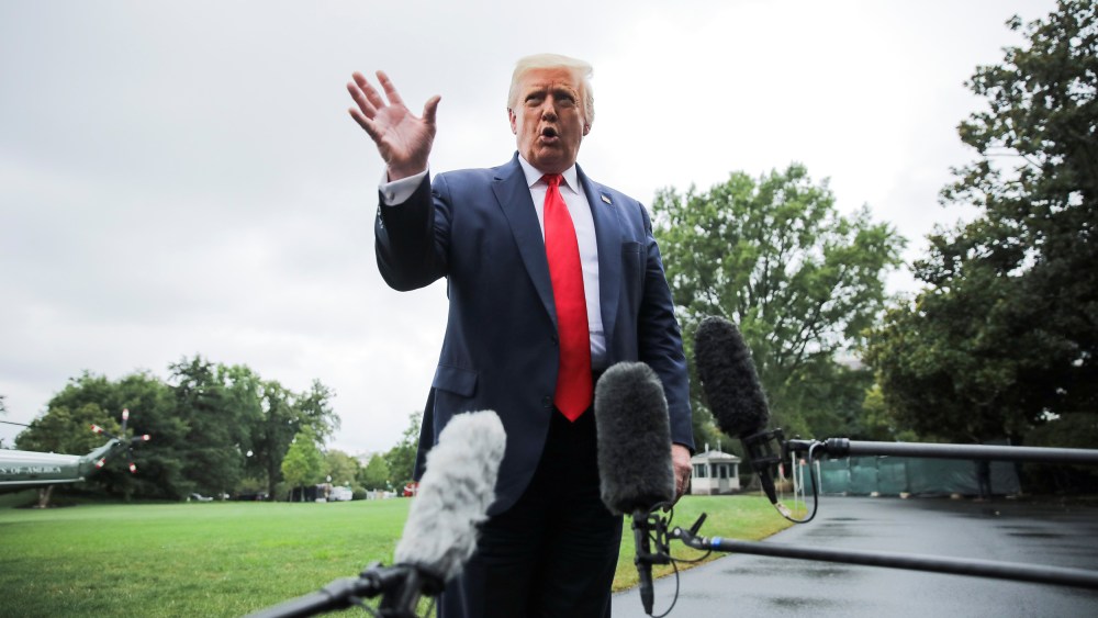 Image: U.S. President Trump speaks to reporters as he departs for a trip to Florida from the White House in Washington