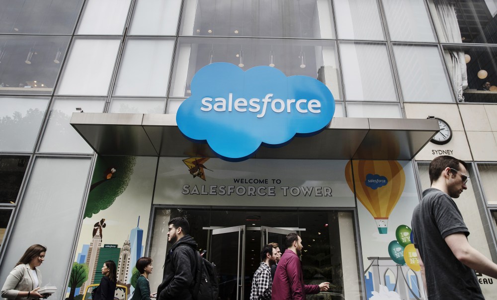 Image: Pedestrians pass in front of the Salesforce Tower in New York on  May 30, 2019.