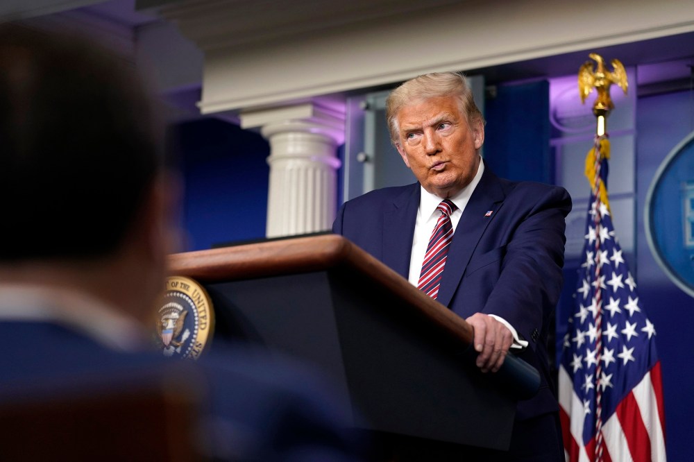 Image: President Donald Trump pauses as he speaks during a news conference at the White House,