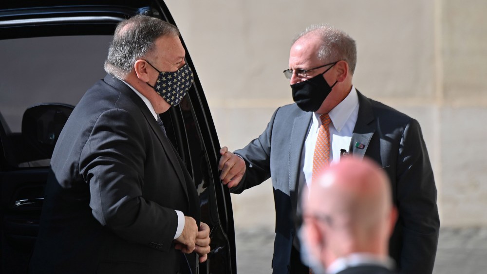 Image: Secretary of State Mike Pompeo gets out of his car as he arrives on Oct.1, 2020 at San Damaso courtyard in The Vatican