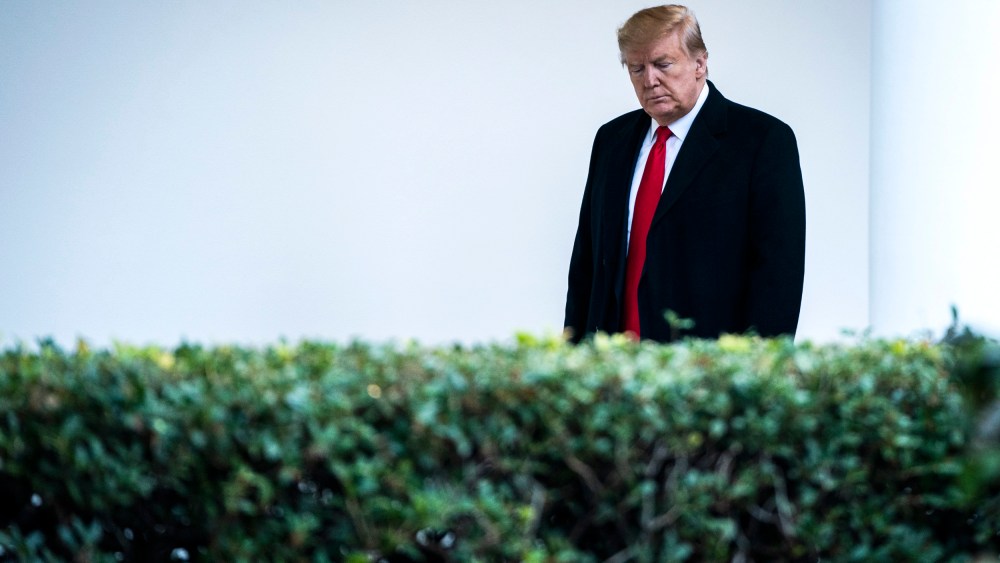 Image: President Donald Trump walks along the White House colonnade on Dec. 17, 2019.