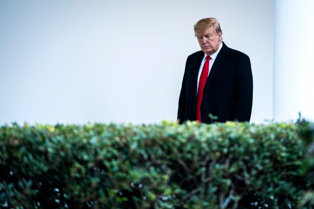 Image: President Donald Trump walks along the White House colonnade on Dec. 17, 2019.