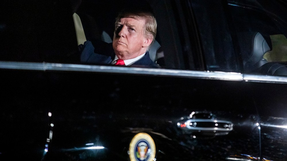 Image: President Donald Trump rides in the presidential limo to deliver his State of the Union at the Capitol on Feb. 5, 2019.