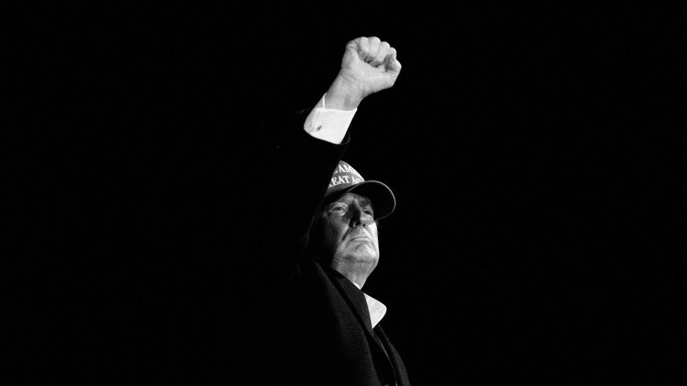 Image: President Donald Trump pumps his fist at a campaign rally in Des Moines, Iowa, on Oct. 14, 2020.