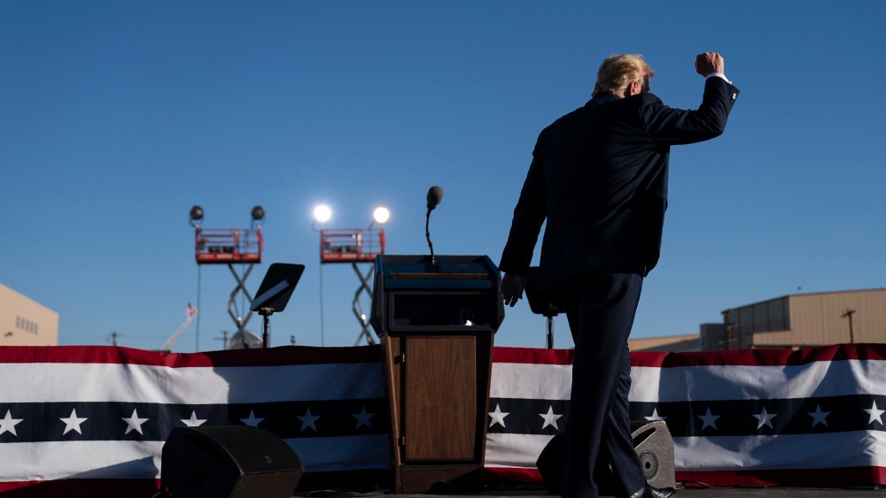 Image: President Donald Trump walks off stage after speaking during a campaign rally at Phoenix Goodyear Airport
