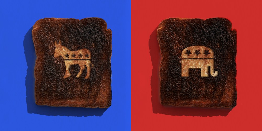 Image: Two burnt toast with the GOP and Democrat part symbol carved into each against blue and red bacckgrounds.